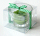 Bougie parfumee sous forme de fleur de couleur vert avec ruban decoratif